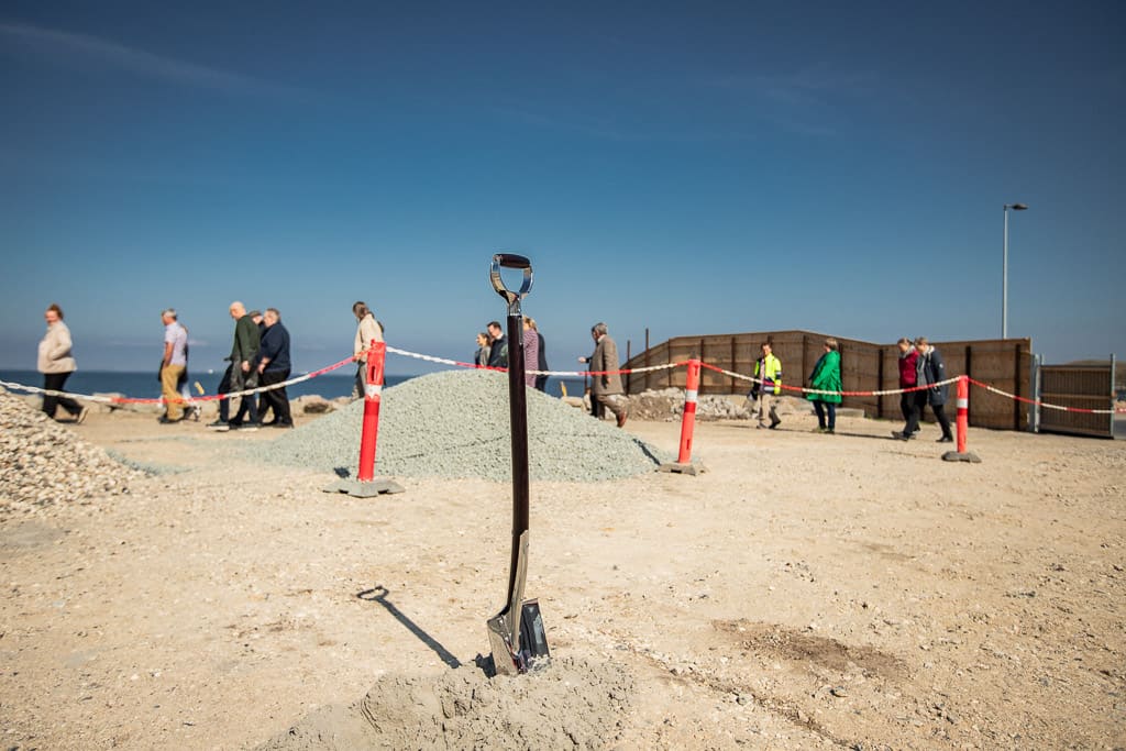 Groundbreaking with a spade on a construction site